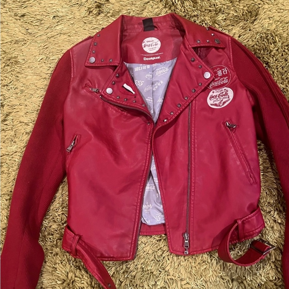 Polyethylene red jacket with studs. Excellent condition.